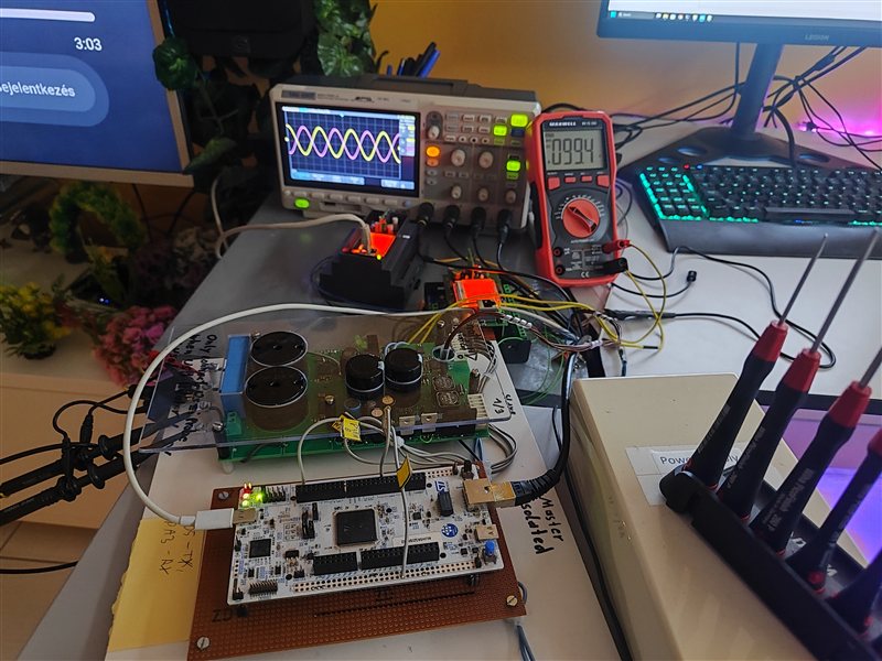 Embedded development board connected to hardware, an oscilloscope, and a multimeter